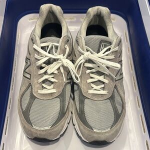Men’s New Balance 990 sneaker in the grey and silver colorway. Size 12.